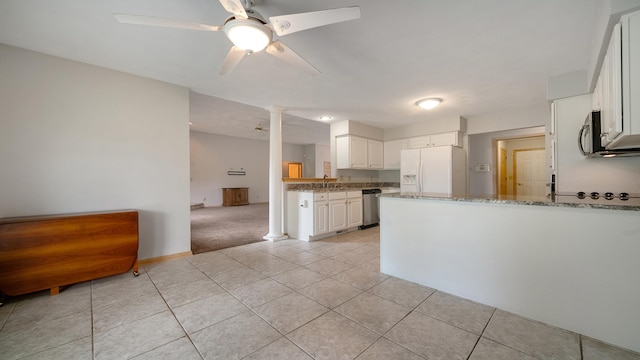 1126 Ingram Rd, Rockford, IL 61108 - kitchen with appliances with stainless steel finishes, a peninsula, a ceiling fan, ornate columns, and light tile patterned flooring