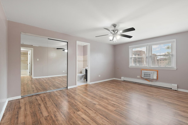 9815 Nottingham Ave Unit 201, Chicago Ridge, IL 60415 - unfurnished bedroom with baseboard heating, wood finished floors, a closet, ensuite bathroom, and a ceiling fan