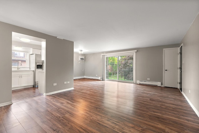 9815 Nottingham Ave Unit 201, Chicago Ridge, IL 60415 - unfurnished living room featuring baseboard heating, dark wood-style flooring, and a wall mounted AC