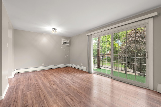 9815 Nottingham Ave Unit 201, Chicago Ridge, IL 60415 - empty room with a wall mounted AC, wood finished floors, and baseboard heating