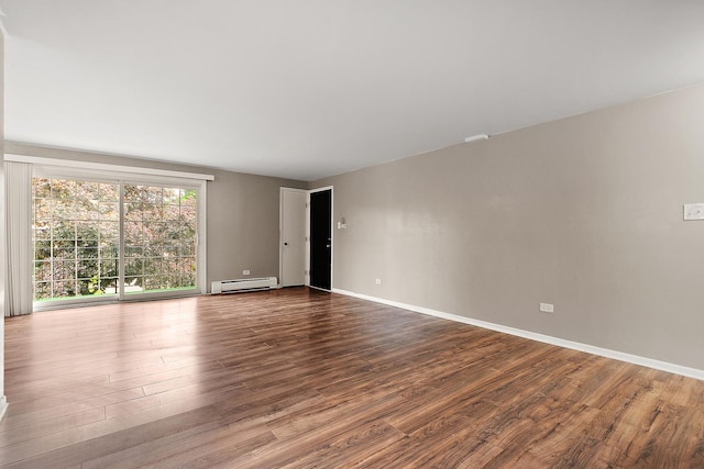 9815 Nottingham Ave Unit 201, Chicago Ridge, IL 60415 - unfurnished room featuring a baseboard heating unit and dark wood-type flooring