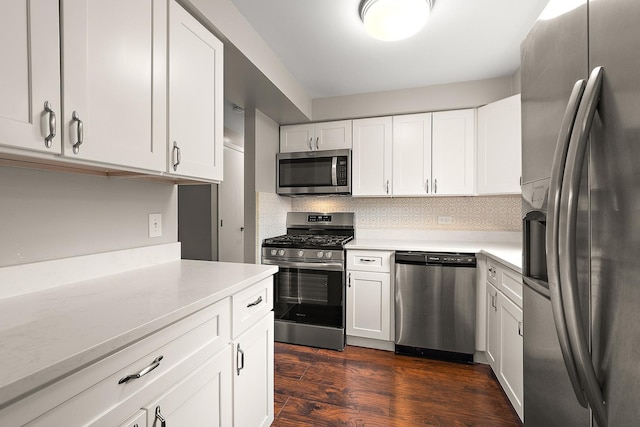 9815 Nottingham Ave Unit 201, Chicago Ridge, IL 60415 - kitchen with appliances with stainless steel finishes, light countertops, white cabinets, dark wood-type flooring, and backsplash