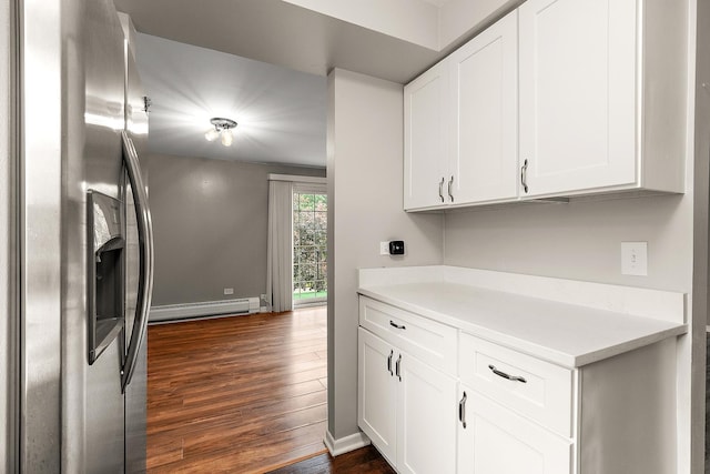 9815 Nottingham Ave Unit 201, Chicago Ridge, IL 60415 - kitchen with baseboard heating, stainless steel refrigerator with ice dispenser, dark wood-style floors, light countertops, and white cabinetry