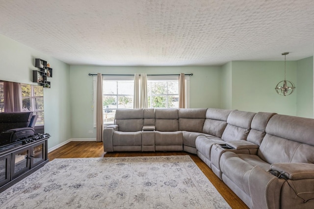 14772 Menard Ave, Oak Forest, IL 60452 - living area with a chandelier, dark wood finished floors, and a textured ceiling