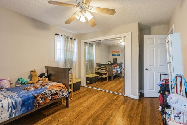 14772 Menard Ave, Oak Forest, IL 60452 - bedroom featuring wood finished floors, a closet, ceiling fan, and a textured ceiling
