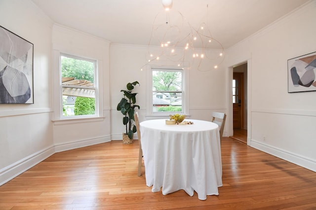 125 S Ridgeland Ave, Oak Park, IL 60302 - dining room with light wood-type flooring, crown molding, and a chandelier