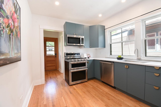 125 S Ridgeland Ave, Oak Park, IL 60302 - kitchen featuring stainless steel appliances, gray cabinetry, plenty of natural light, light wood-type flooring, and recessed lighting