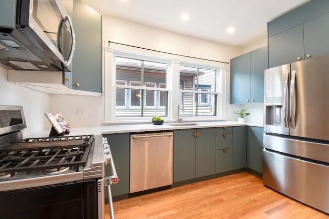 125 S Ridgeland Ave, Oak Park, IL 60302 - kitchen with stainless steel appliances, light wood-type flooring, light countertops, recessed lighting, and gray cabinetry