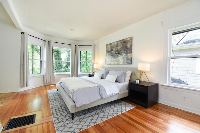 125 S Ridgeland Ave, Oak Park, IL 60302 - bedroom with multiple windows and light wood-type flooring