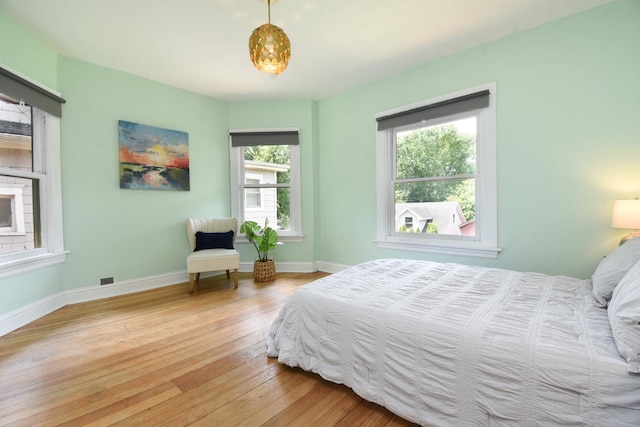 125 S Ridgeland Ave, Oak Park, IL 60302 - bedroom featuring multiple windows and wood-type flooring