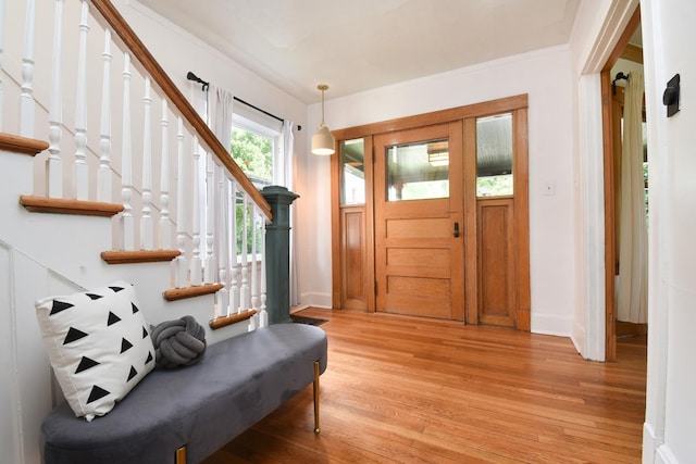 125 S Ridgeland Ave, Oak Park, IL 60302 - foyer entrance featuring light wood-style floors, stairs, and crown molding
