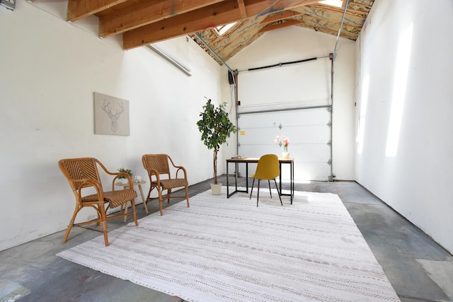 125 S Ridgeland Ave, Oak Park, IL 60302 - living area with concrete floors, a garage, and high vaulted ceiling