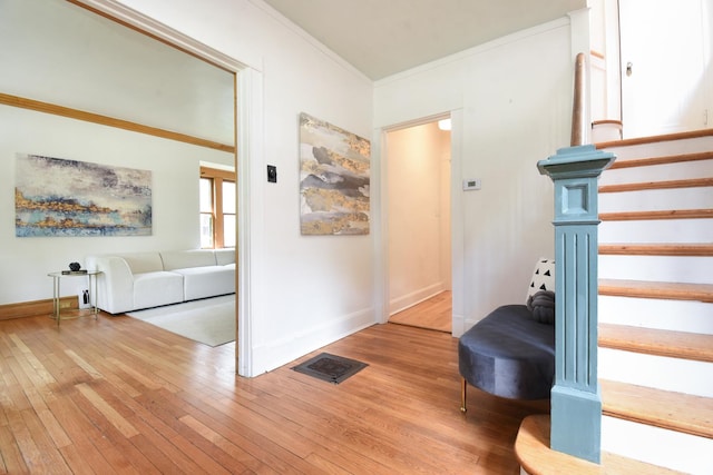 125 S Ridgeland Ave, Oak Park, IL 60302 - staircase with crown molding and wood-type flooring