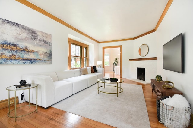 125 S Ridgeland Ave, Oak Park, IL 60302 - living area featuring wood-type flooring, crown molding, and a brick fireplace