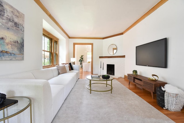 125 S Ridgeland Ave, Oak Park, IL 60302 - living room with wood finished floors, crown molding, and a fireplace