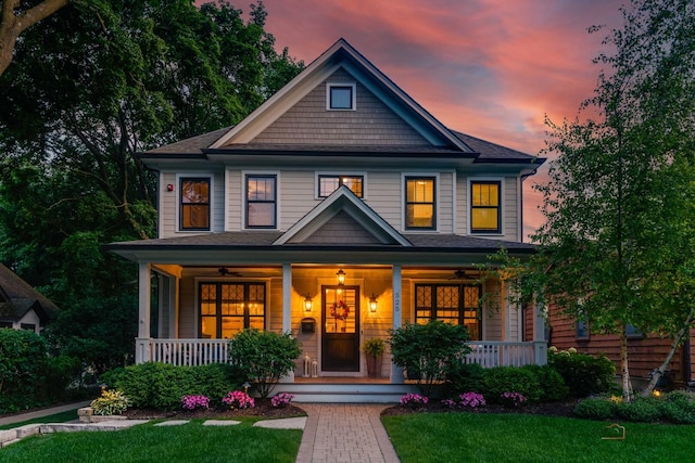 525 Meadow Ln, Libertyville, IL 60048 - craftsman-style home featuring a porch, ceiling fan, and a front lawn