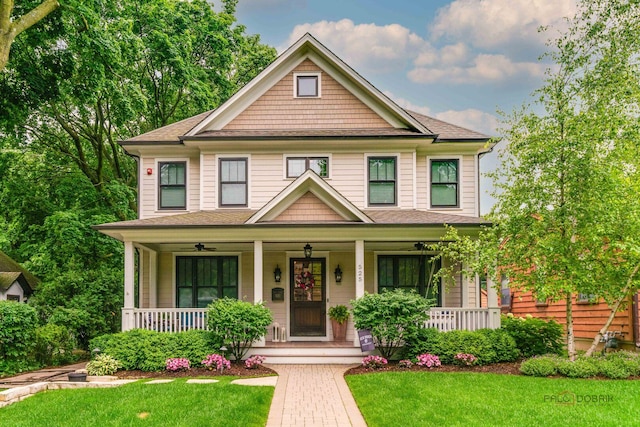 525 Meadow Ln, Libertyville, IL 60048 - view of front of house with a porch, a front lawn, and a shingled roof