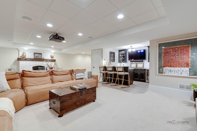 525 Meadow Ln, Libertyville, IL 60048 - living room with bar area, a large fireplace, light carpet, and recessed lighting