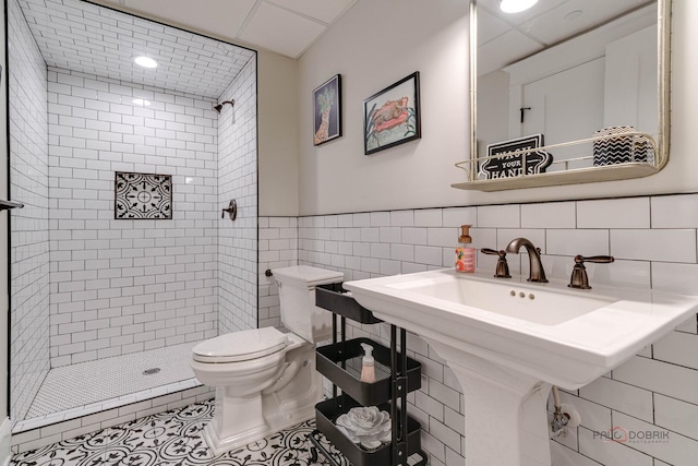 525 Meadow Ln, Libertyville, IL 60048 - bathroom featuring a shower stall, tile walls, tile patterned flooring, and a wainscoted wall