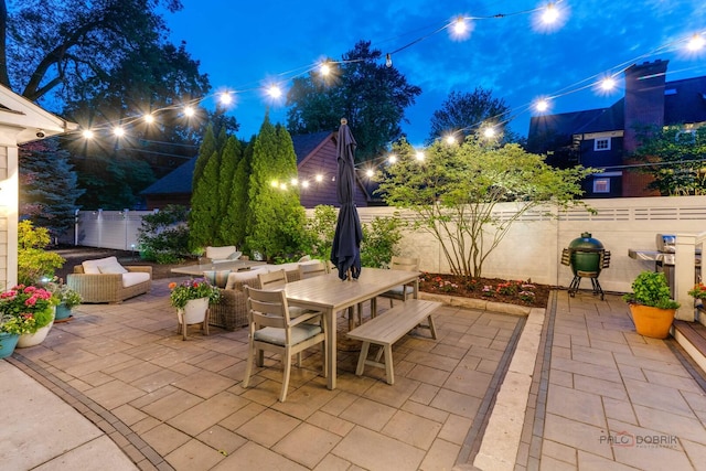 525 Meadow Ln, Libertyville, IL 60048 - patio at night featuring a patio, outdoor dining space, and an outdoor living space