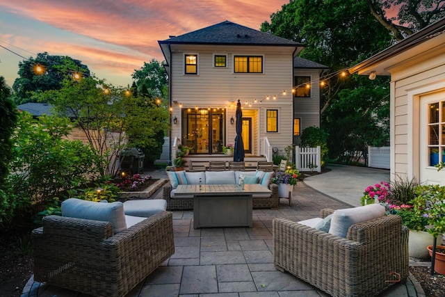 525 Meadow Ln, Libertyville, IL 60048 - back of house at dusk with outdoor lounge area and a patio area