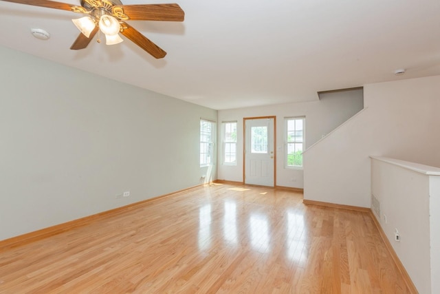28 Primrose Ln, Oswego, IL 60543 - unfurnished room with a smoke detector, light wood-style floors, and a ceiling fan