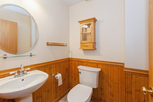 28 Primrose Ln, Oswego, IL 60543 - half bathroom featuring wainscoting and wood walls