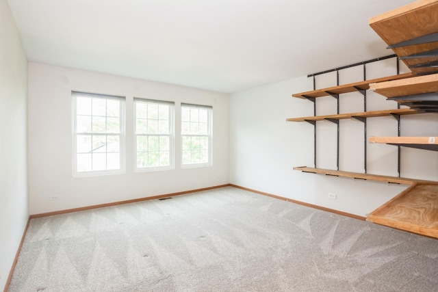 28 Primrose Ln, Oswego, IL 60543 - carpeted empty room featuring baseboards