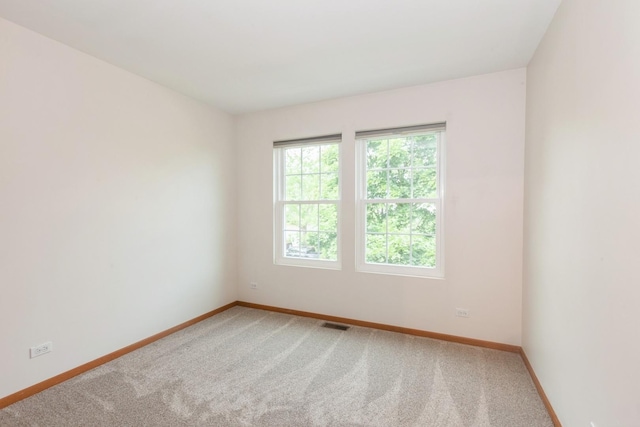 28 Primrose Ln, Oswego, IL 60543 - carpeted empty room with baseboards