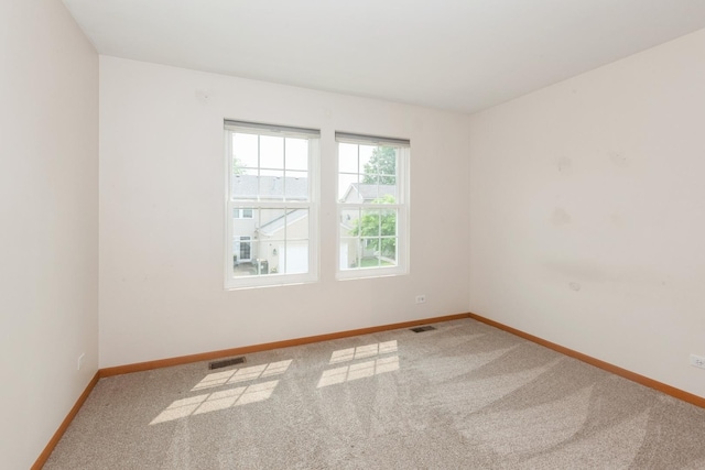 28 Primrose Ln, Oswego, IL 60543 - carpeted empty room featuring baseboards