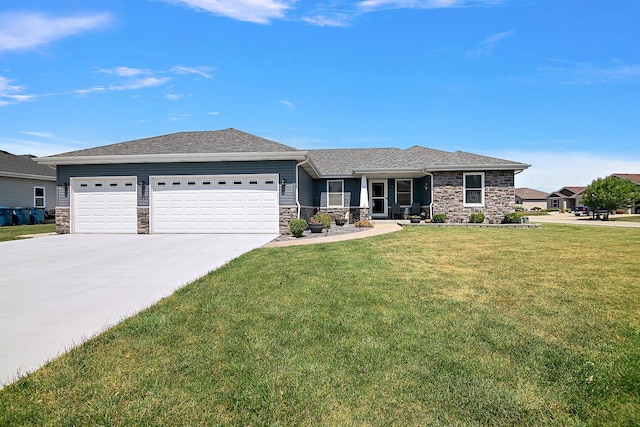 1867 Robert Dr, Bourbonnais, IL 60914 - view of front of home featuring stone siding, a garage, driveway, and a front lawn
