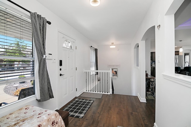 1867 Robert Dr, Bourbonnais, IL 60914 - entryway featuring hardwood / wood-style flooring and arched walkways