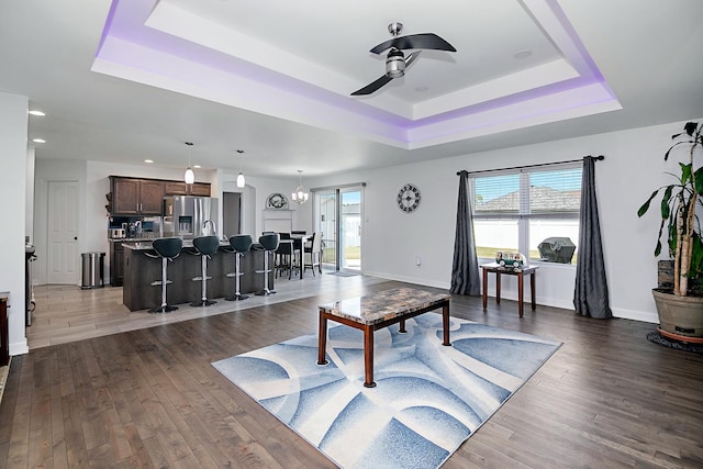 1867 Robert Dr, Bourbonnais, IL 60914 - living room with a tray ceiling, a ceiling fan, wood finished floors, and recessed lighting