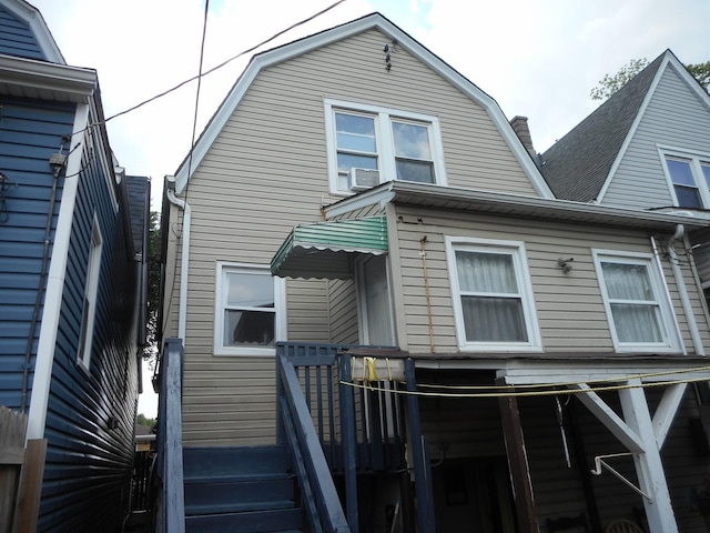 2820 W 36th St, Chicago, IL 60632 - rear view of property with a gambrel roof and cooling unit