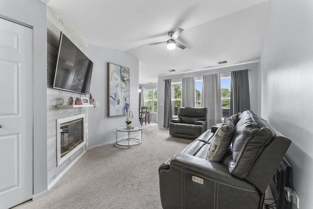 1028 Wynnfield Ct Unit C, Elgin, IL 60120 - carpeted living room with ceiling fan, a large fireplace, and lofted ceiling