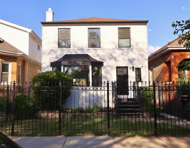 2913 N Kolmar Ave, Chicago, IL 60641 - view of front of home featuring a fenced front yard, a chimney, and brick siding