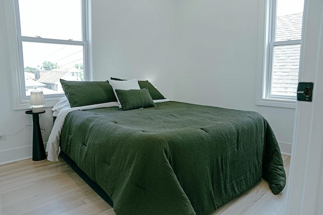 2913 N Kolmar Ave, Chicago, IL 60641 - bedroom with light wood finished floors and multiple windows