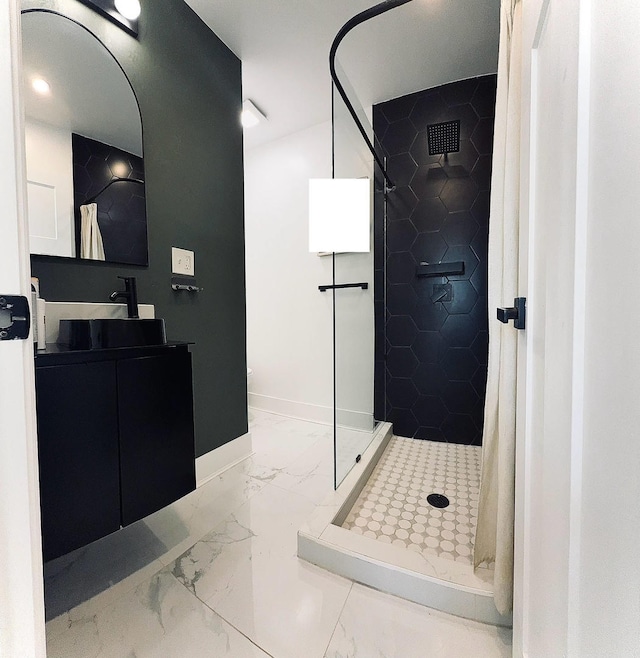 2913 N Kolmar Ave, Chicago, IL 60641 - bathroom with marble finish flooring, a stall shower, and vanity