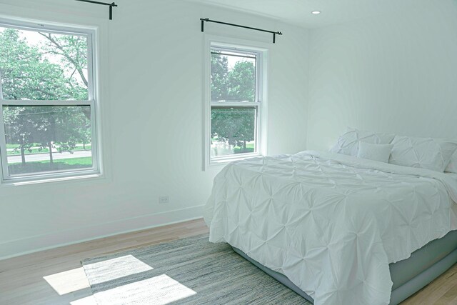 2913 N Kolmar Ave, Chicago, IL 60641 - bedroom with wood finished floors and multiple windows