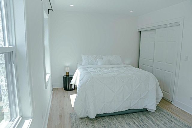 2913 N Kolmar Ave, Chicago, IL 60641 - bedroom with light wood finished floors, a closet, and recessed lighting