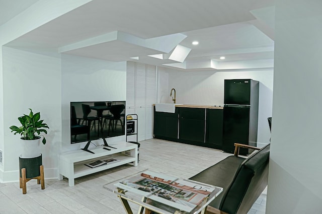 2913 N Kolmar Ave, Chicago, IL 60641 - living area with recessed lighting, a skylight, and a tray ceiling