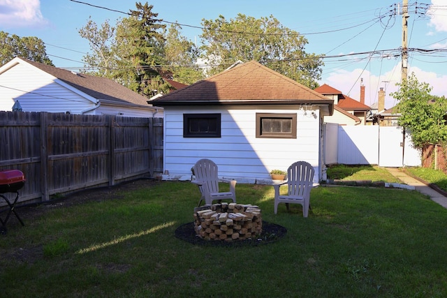 2913 N Kolmar Ave, Chicago, IL 60641 - back of house with a fenced backyard, a fire pit, and a shingled roof