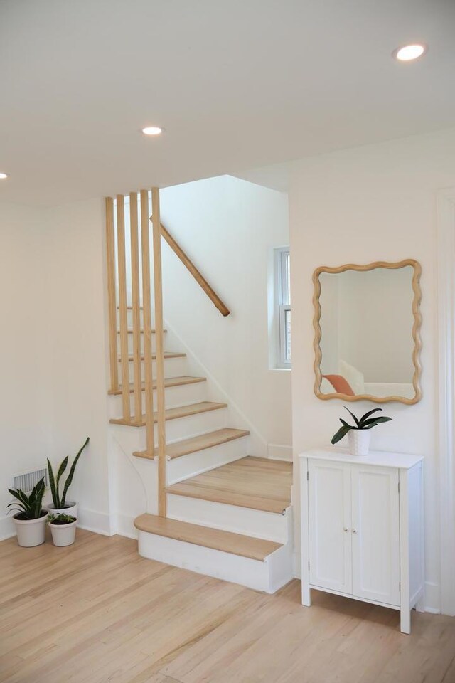 2913 N Kolmar Ave, Chicago, IL 60641 - stairway with wood finished floors and recessed lighting