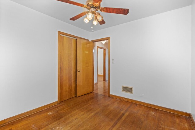 5144 W Saint Paul Ave, Chicago, IL 60639 - spare room featuring wood finished floors and ceiling fan