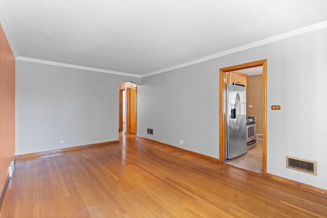 5144 W Saint Paul Ave, Chicago, IL 60639 - spare room with ornamental molding and light wood-style flooring