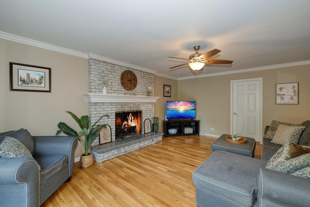 6S503 Bridlespur Dr, Naperville, IL 60540 - living room featuring a brick fireplace, crown molding, light wood finished floors, and a ceiling fan