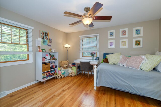 6S503 Bridlespur Dr, Naperville, IL 60540 - bedroom featuring multiple windows, light wood-type flooring, and a ceiling fan