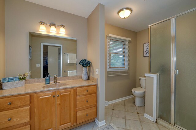 6S503 Bridlespur Dr, Naperville, IL 60540 - bathroom with vanity, a stall shower, and tile patterned floors
