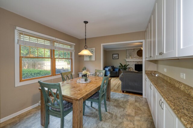 6S503 Bridlespur Dr, Naperville, IL 60540 - dining area with a fireplace and baseboards