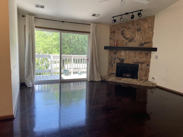 216 Charleston Ct Unit 8, Schaumburg, IL 60193 - unfurnished living room with track lighting, ceiling fan, wood finished floors, and a stone fireplace